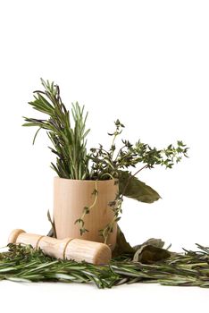 Preparing herbs in a mortar and pestle.