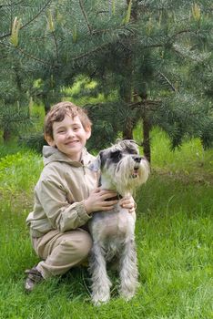 Little boy with his dog in the park