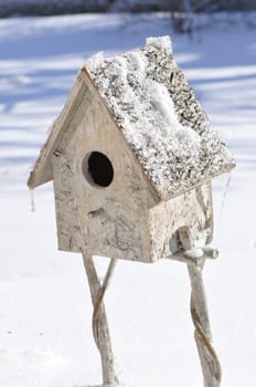Little house to protect birds during winter in a field