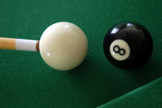  close view of the eight ball and cue ball about to be struck                               