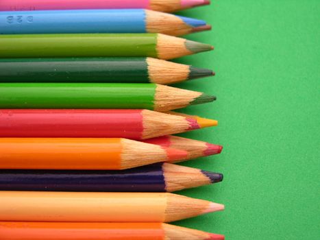 Colored pencils shown in a row closeup