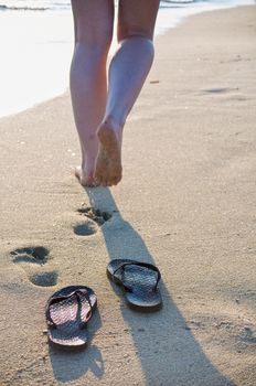 Someone leaves on the beach her flip flops behind