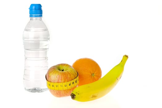 a bottle of water and some fruit on a white background