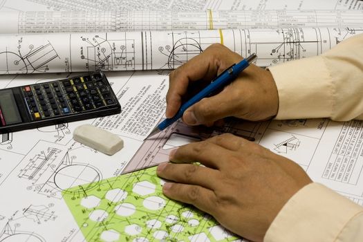 Engineer drafting with templates,eraser & pencil -for engineering ,construction &  architecture .