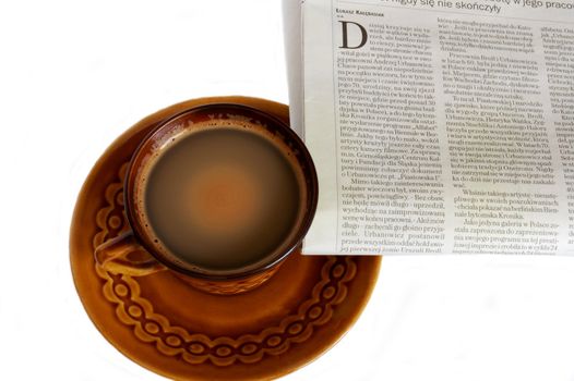 cup of coffee and newspaper isolated on the white background