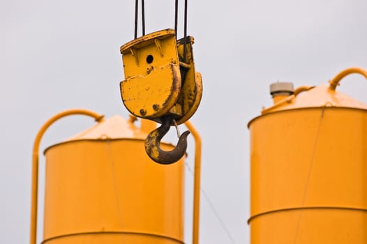 Yellow hook and gravel silos in a building site