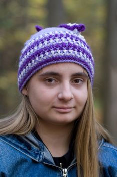 Portrait of the beautiful girl in autumn forest. 
