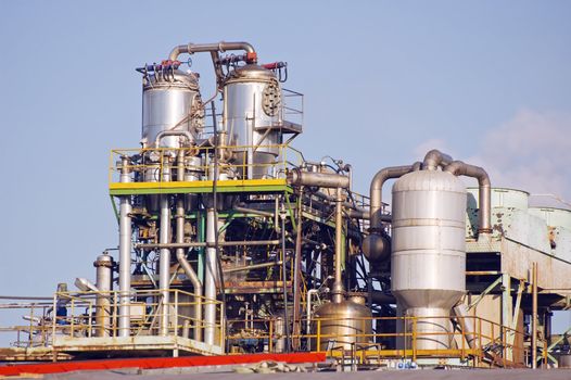 Close-up of induistrial plant with pipes and chimneys