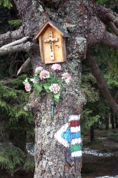 chapel on tree end sign-post