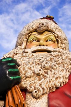 Imposing Santa claus figure against a cloudy sky