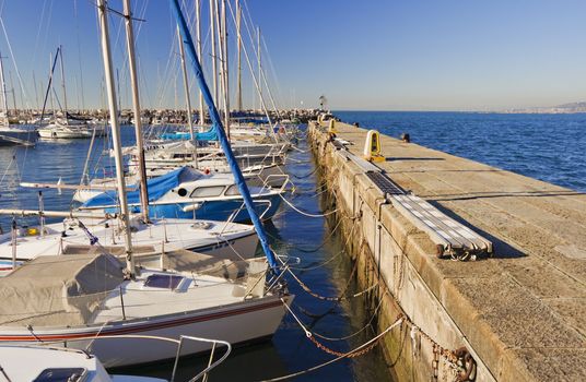 Boats moored to wharf in a harboaur