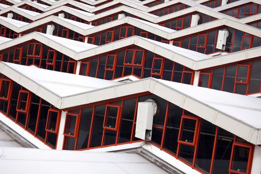 Long repetition of windows on a building rooftop