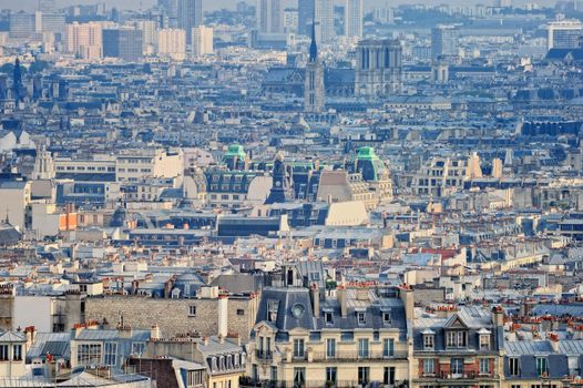 Aerial panorama above houses rooftops in a Paris