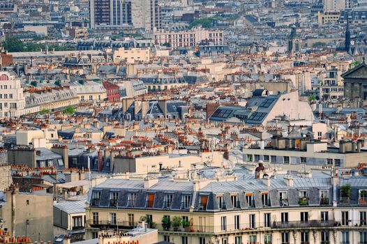 Aerial panorama above houses rooftops in a Paris
