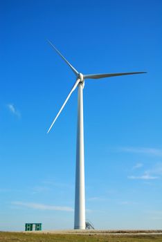 Windmill in Romania gathers energy from the summer breeze.