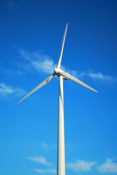 Windmill in Romania gathers energy from the summer breeze.