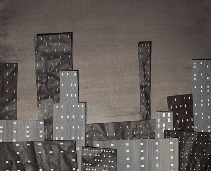 Sepia coloured city made from cut out painted card