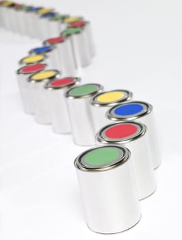 Colored Paint cans in a row on white background