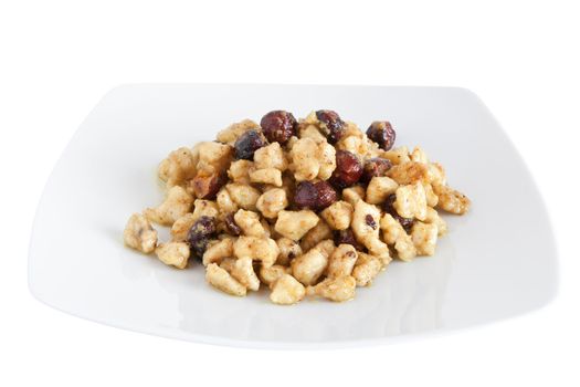 plate with chicken and nuts isolated on white background with clipping path