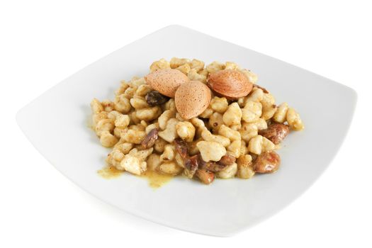 chicken with almonds and curry sauce isolated on white with clipping path