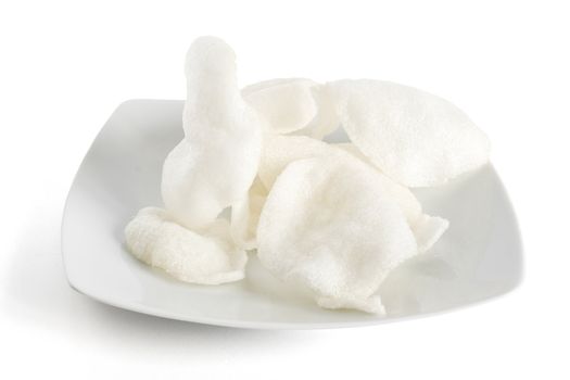 plate with shrimp chips isolated on white background with clipping path