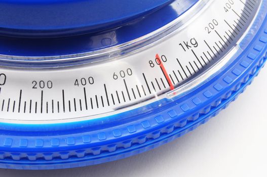 blue kitchen scales or balance showing cooking concept