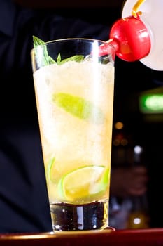 Drink being prepared by bartender