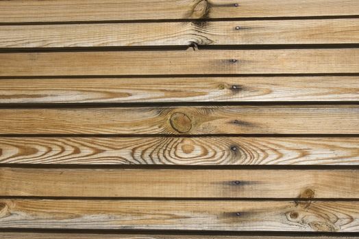 A background of weathered dark painted wood