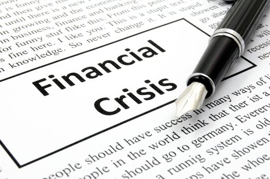 financial crisis concept with fake newspaper showing economic downturn
