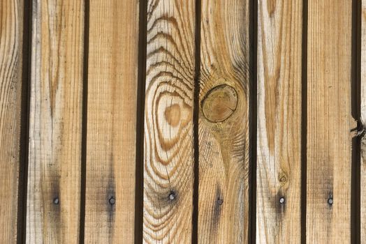 A background of weathered dark painted wood