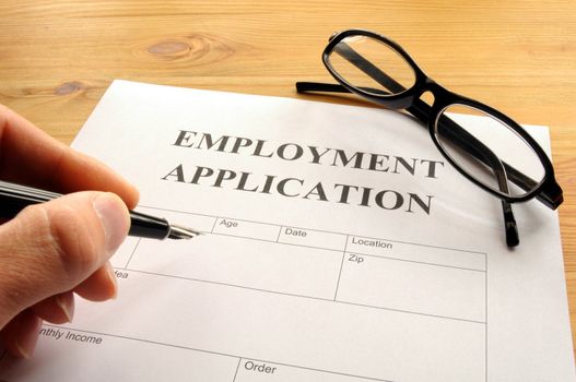 employment application form on desk showing job search concept