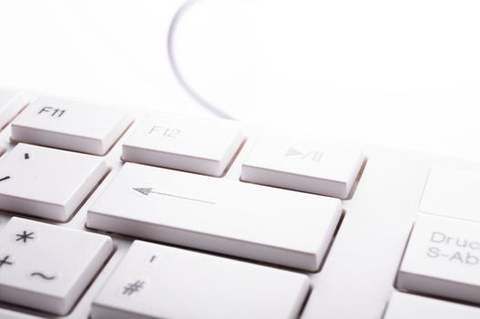 modern computer keyboard on white showing pc or technology concept