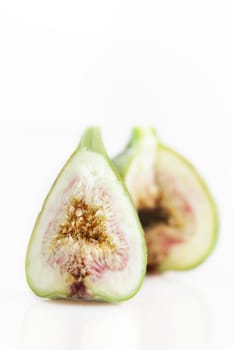 Fig with section cut out isolated on white background vertical orientation.