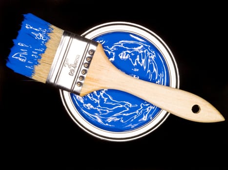 Blue Paint can and brush from above on black background