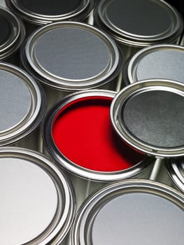 Paint cans full frame with a red can opened