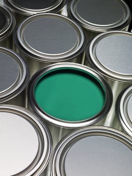 Paint cans full frame with a green can opened