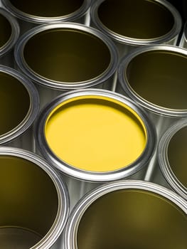 Paint cans full frame with Yellow paint in one of them