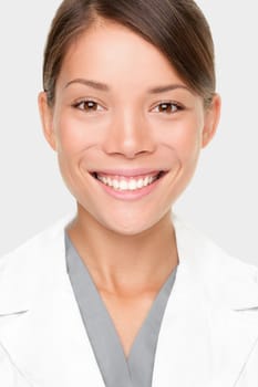 Pharmacist. Portrait of young professional woman pharmacist or scientist in lab coat. Smiling mixed race Caucasian / Asian woman.
