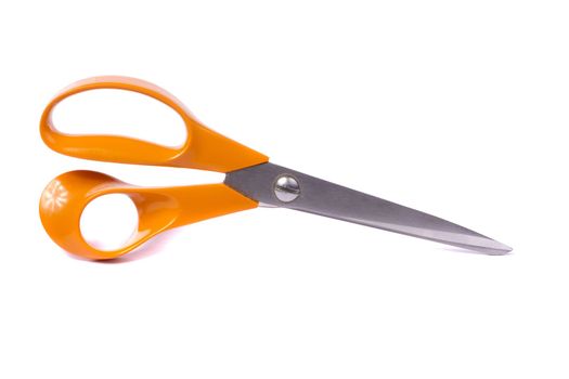 Close up view of an orange scissor isolated on a white background.