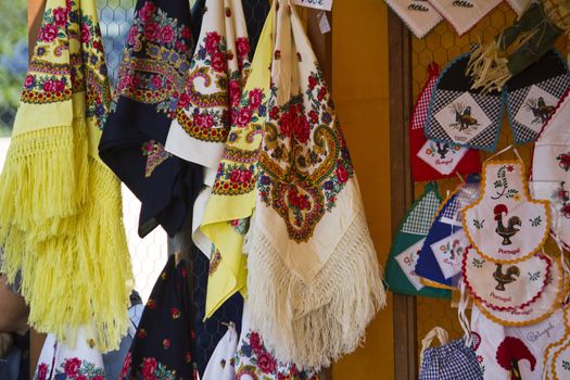 Close view of a bunch of traditional Portuguese napkins hanging on a street fair.
