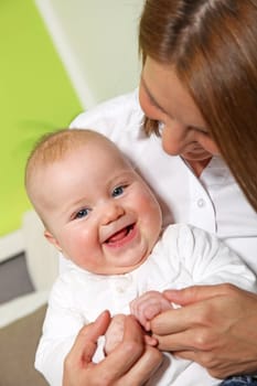  Loving mother and happy baby laughing
