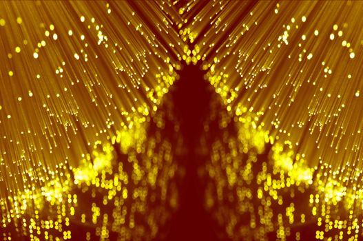 Close up abstract style capturing the ends of many illuminated fibre optic light strands reflecting into the foreground.