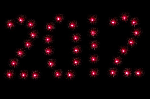Many small illuminated red fibre optic lamps arranged on black background to spell the number 2012