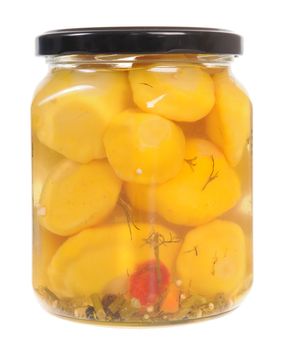 Jar of pickled patison squash isolated on white background