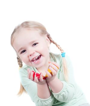 Studio shot of little girl playing with colors