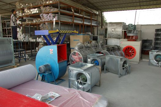 CANTON, CHINA - NOVEMBER 11: One of the biggest manufacturer of auto spray booths and generators in China. Car industry became very important element of Chinese economy growth. Factory tour on November 11, 2010.