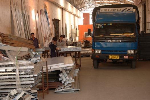 CANTON, CHINA - NOVEMBER 11: One of the biggest manufacturer of auto spray booths and generators in China. Car industry became very important element of Chinese economy growth. Factory tour on November 11, 2010.
