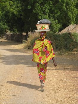 african woman dressed in a traditional way in Cameroon