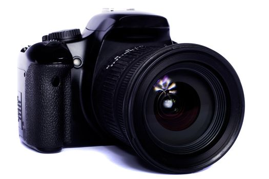 Close view of a modern photographic DSLR camera isolated on a white background.
