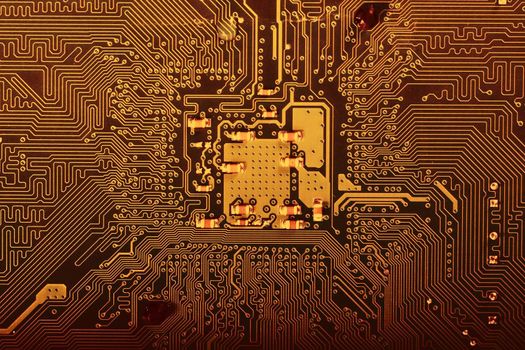 Close view of the circuits of a modern computer motherboard.